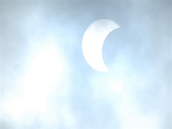  On cloudy day Solar Eclipse as seen in Indianapolis (USA) on October 14, 2023.- Photo By Balbir Singh
